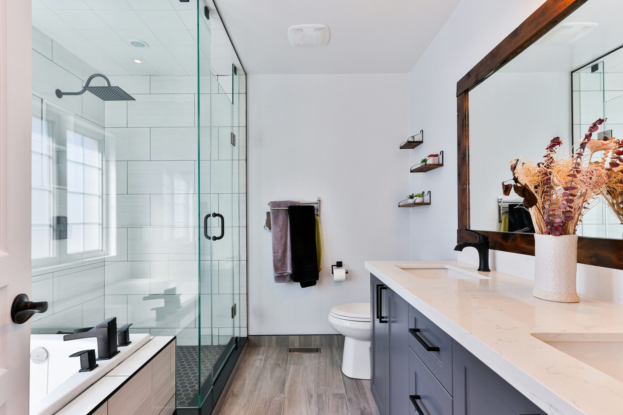 remodeled bathroom with standing shower and separate tub